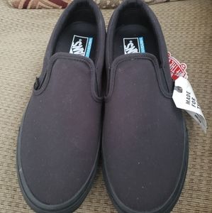 Men's 10.5 women's 12 black slip on VANS shoes